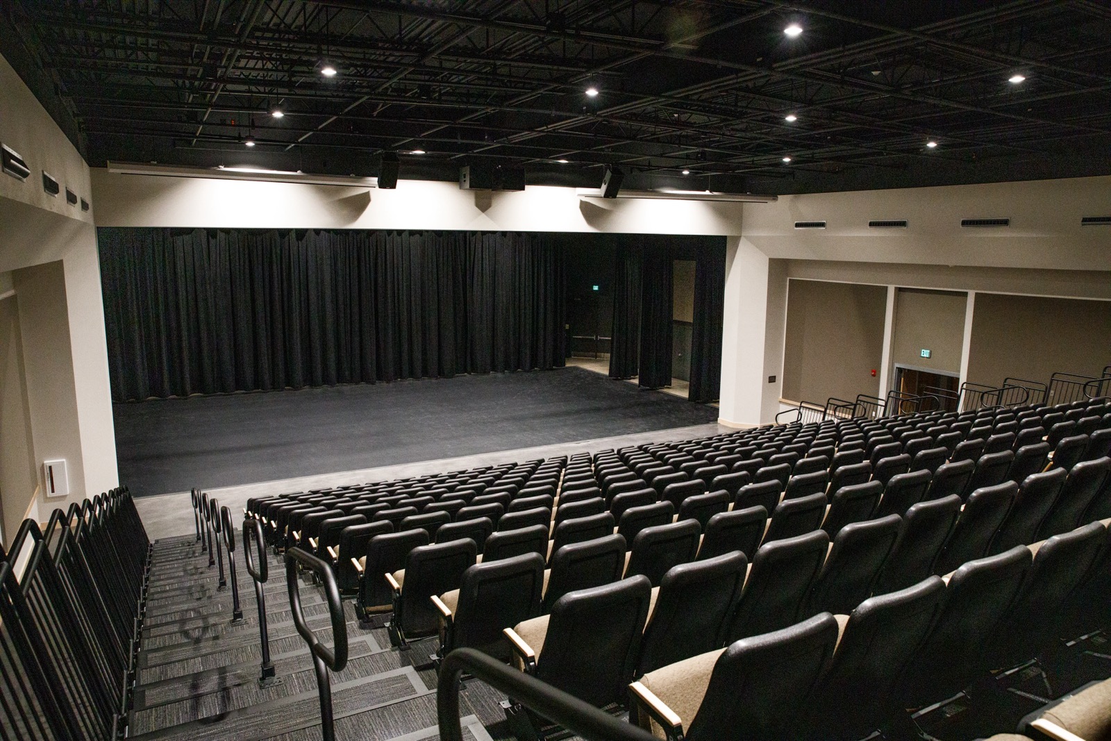 Rows of stadium-style seats facing the stage in the Elizabeth V. Lyles Theater