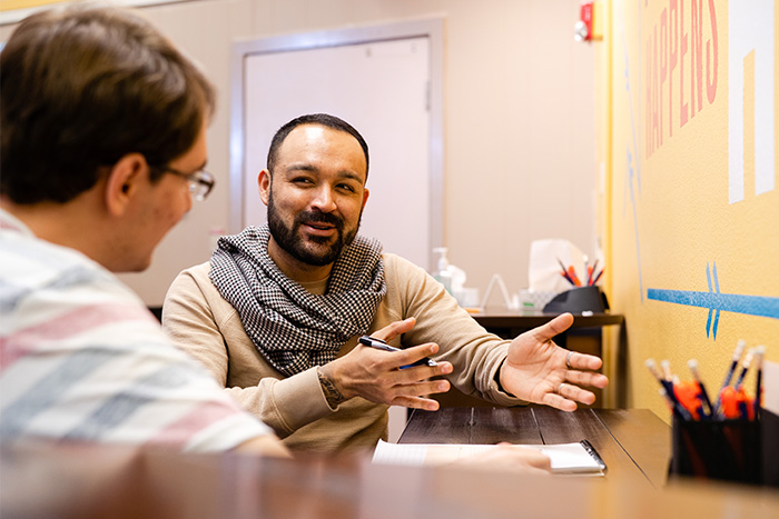 Image of college counselor helping a student