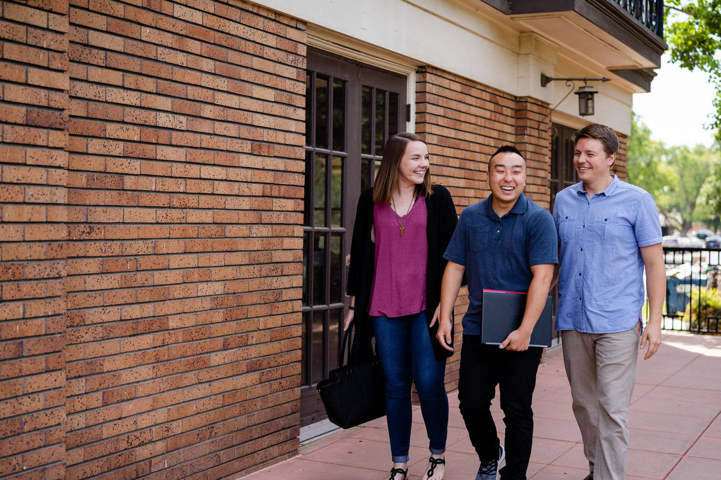 three students visiting campus