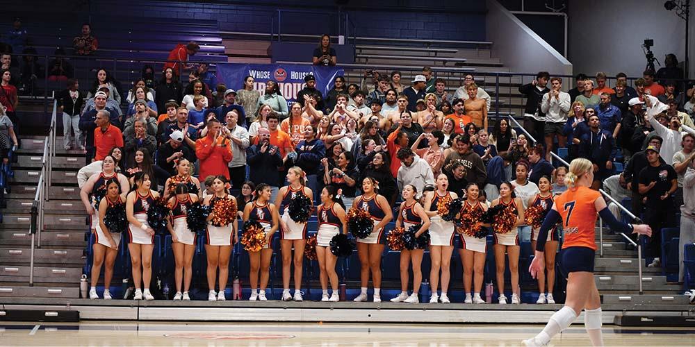 FPU cheerleaders and staff cheering
