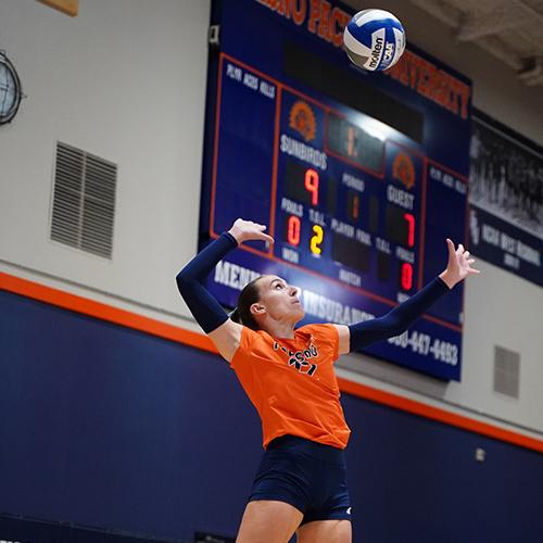 Photo of FPU volleyball player spiking the ball.