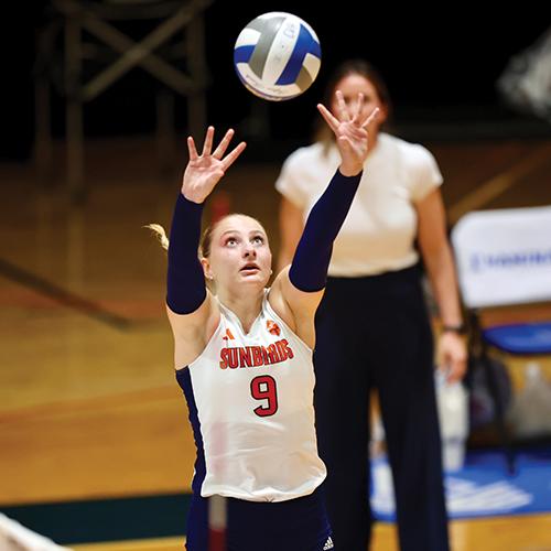 Photo of FPU volleyball player setting the ball