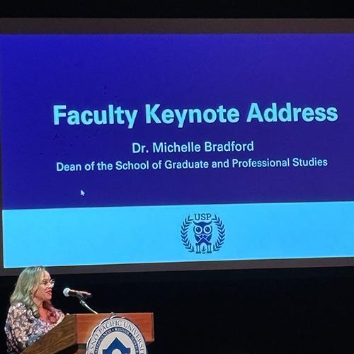 Photo of Michelle Bradford speaking at USP Honors Banquet