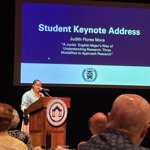 Photo of Judith Flores Mora speaking at USP Honors Banquet