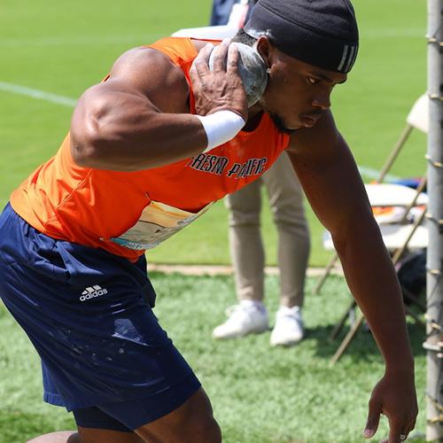 College track and field athlete competing