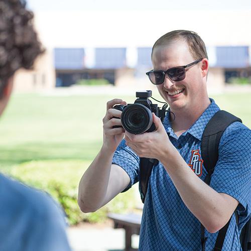 Photographer holding a camera