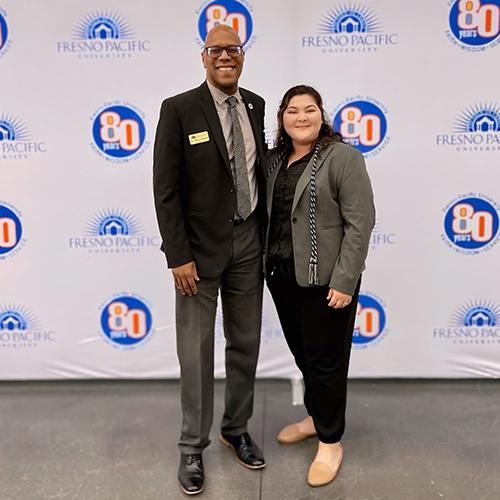 Franny stand with Fresno Pacific University President André Stephens