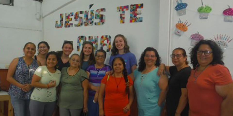 Image of a group of figures smiling