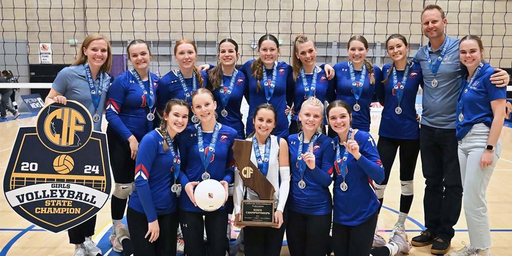 Group photo of volleyball team smiling