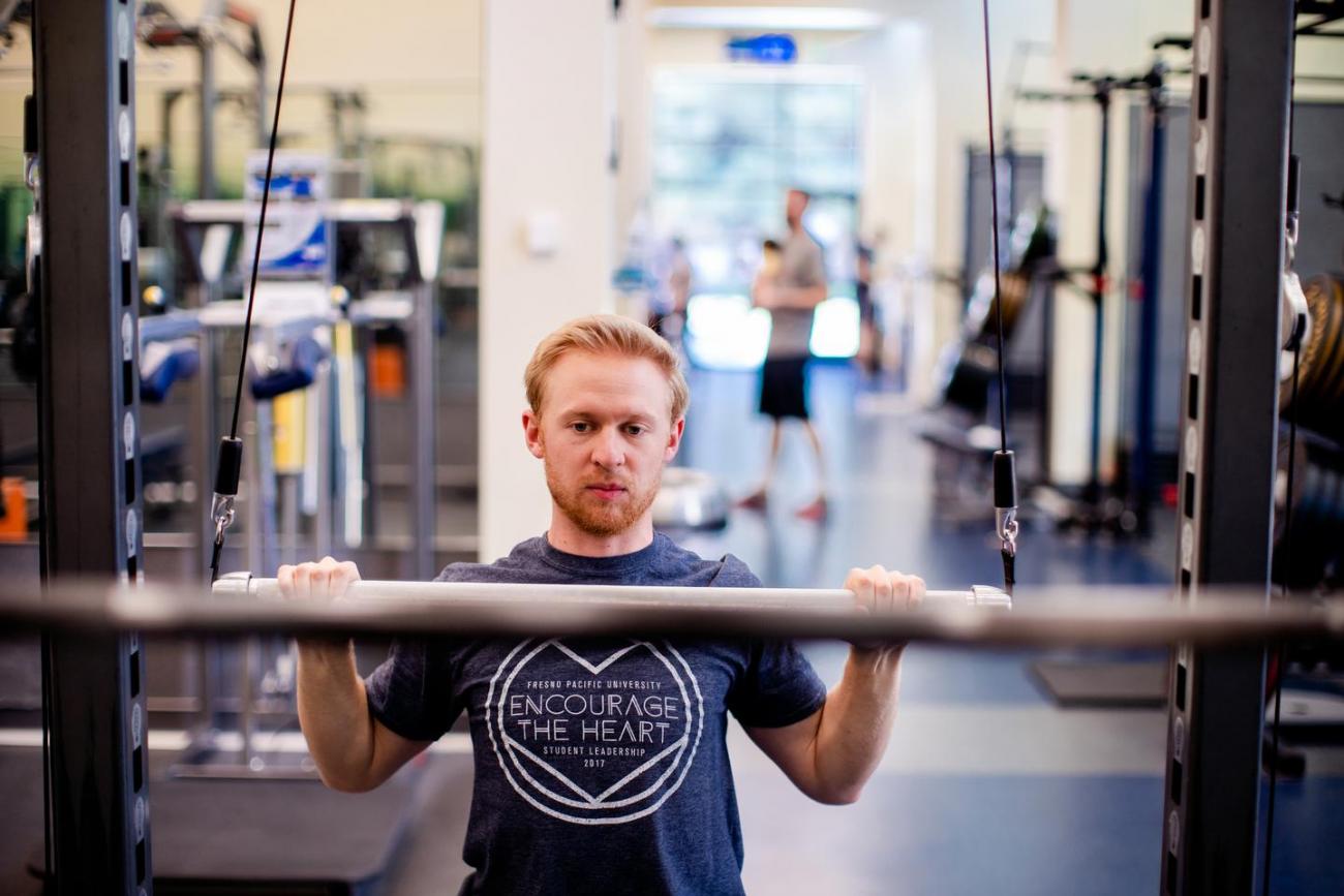 Athlete exercising in fitness center