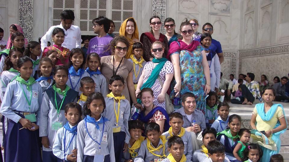 FPU students in India posing with childrens group
