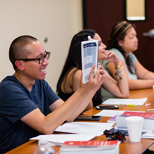 College student reading a book