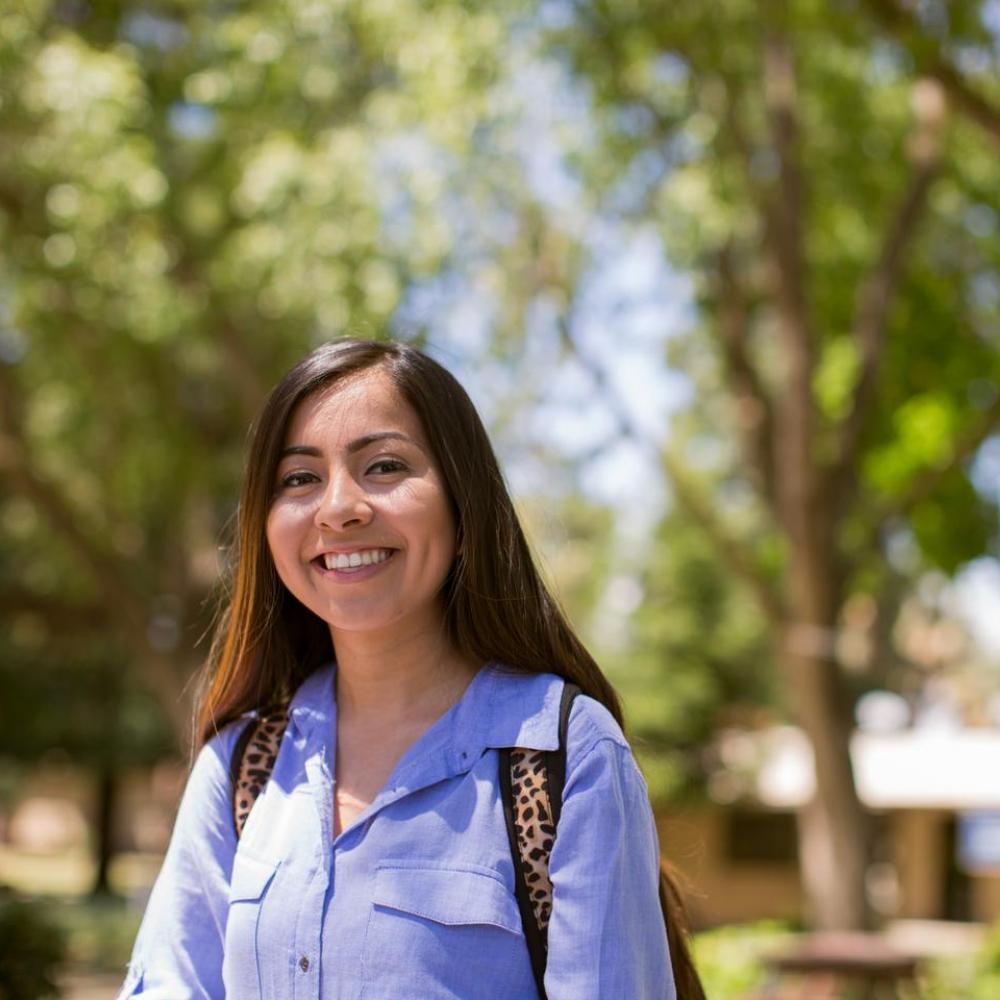 Student smiling in the Forest