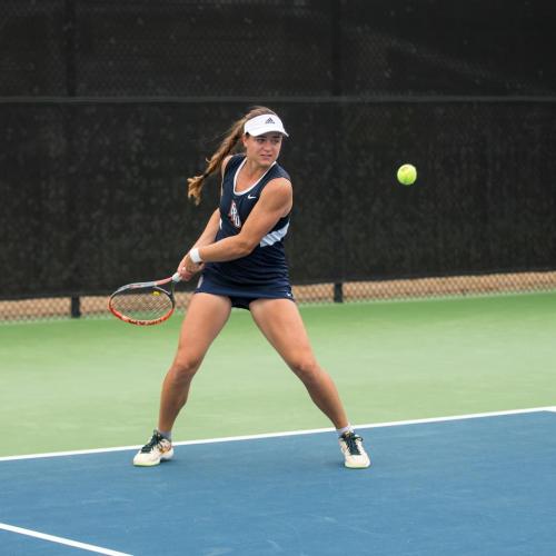 FPU tennis player about to hit the ball