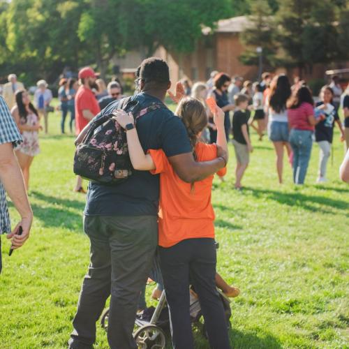 Two FPU students embracing on The Green