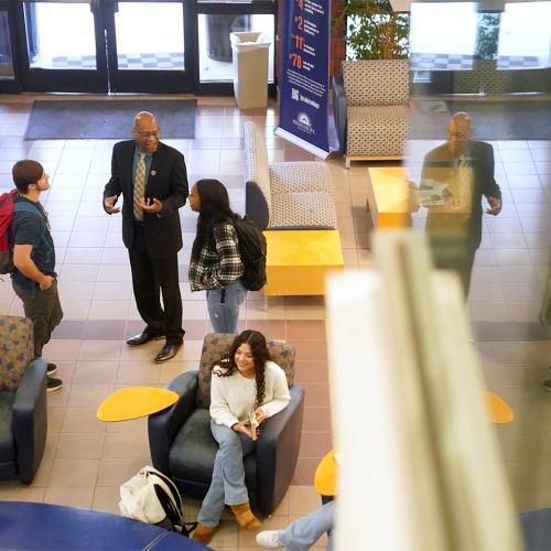 President Stephens talking with students