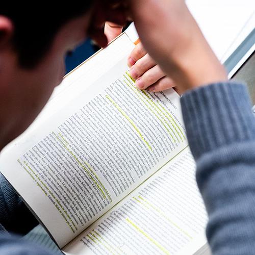 Student reading a book