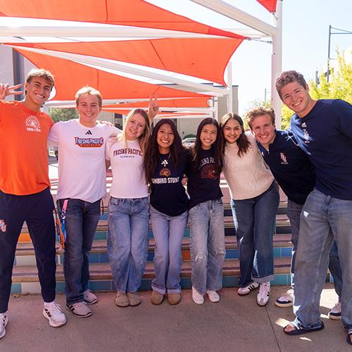 College students standing and smiling