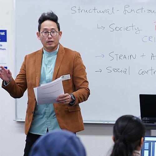 Photo of Professor Lloyd Chia teaching
