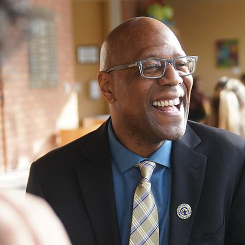 President Stephens smiling and laughing