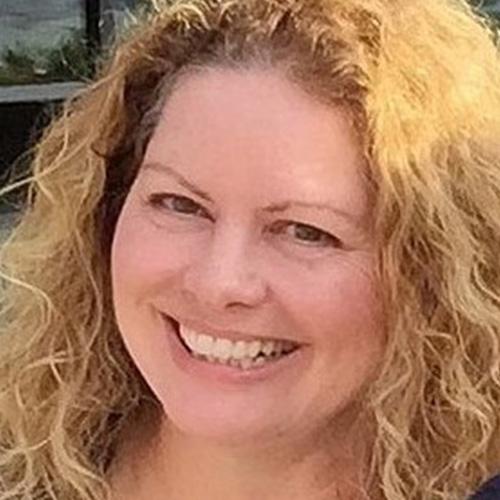Image of an author smiling