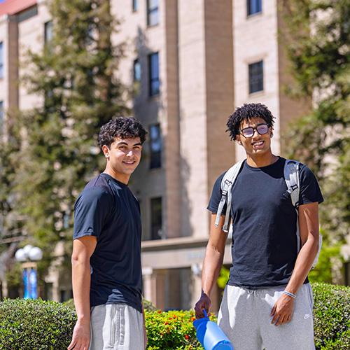 FPU students standing and smiling
