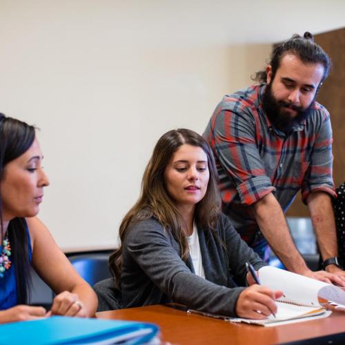 Degree completion students working together in a classroom