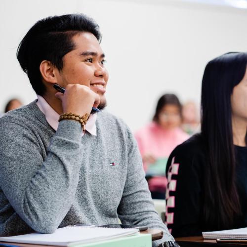 Two students listening to a lecture