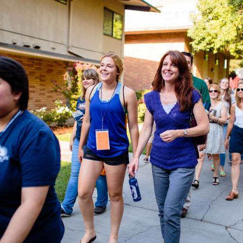 Group of new students and their parents touring campus