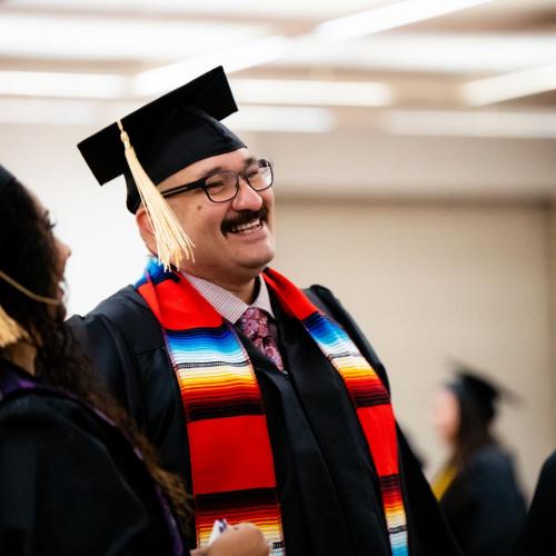 A graduate talking before the ceremony