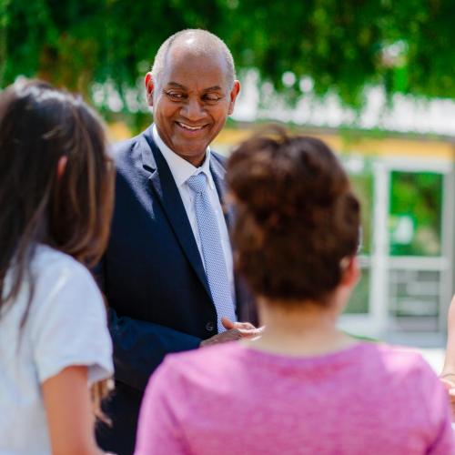 President Jones in the Forest talking to students