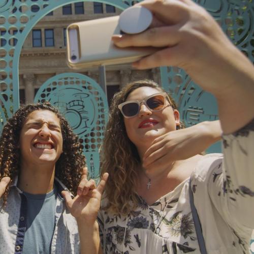 Two students in downtown Fresno taking a selfie