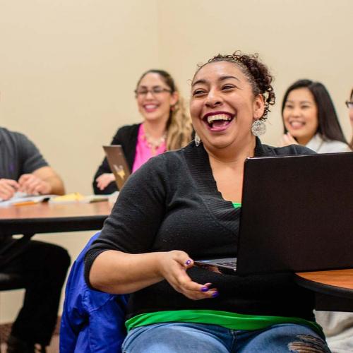Student in class laughing