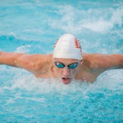 FPU swimmer coming up for air during a race