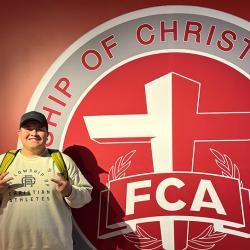Photo of Brandon Moreno in front of an FCA mural