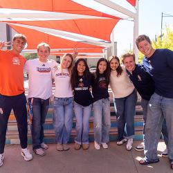College students standing and smiling
