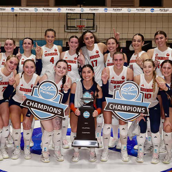 Photo of FPU Sunbirds women volleyball team posing with a trophy