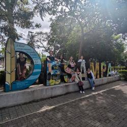 Image of students sitting by a decorative sculpture