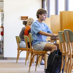 Image of student in library