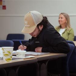 CCT participant writing notes