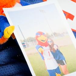 Sunny the Sunbird and FPU student smiling