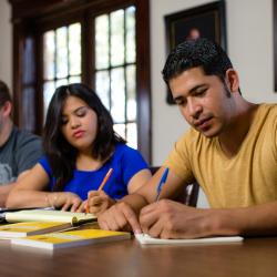 Students in the seminary house taking notes