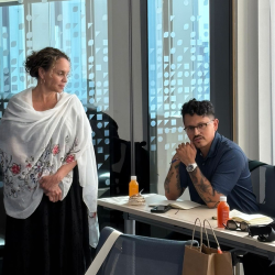 MBA student: Jordan Soliz and a lady at a desk